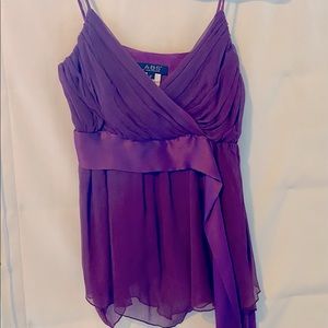 Luscious purple layers of silk low cut camisole w self sash & disco-cut hem.